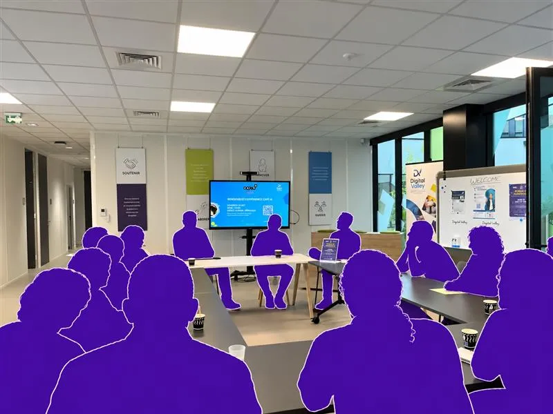 Un atelier Café IA à l'Espace Aliénor : des participants réunis autour d'une grande table de travail.